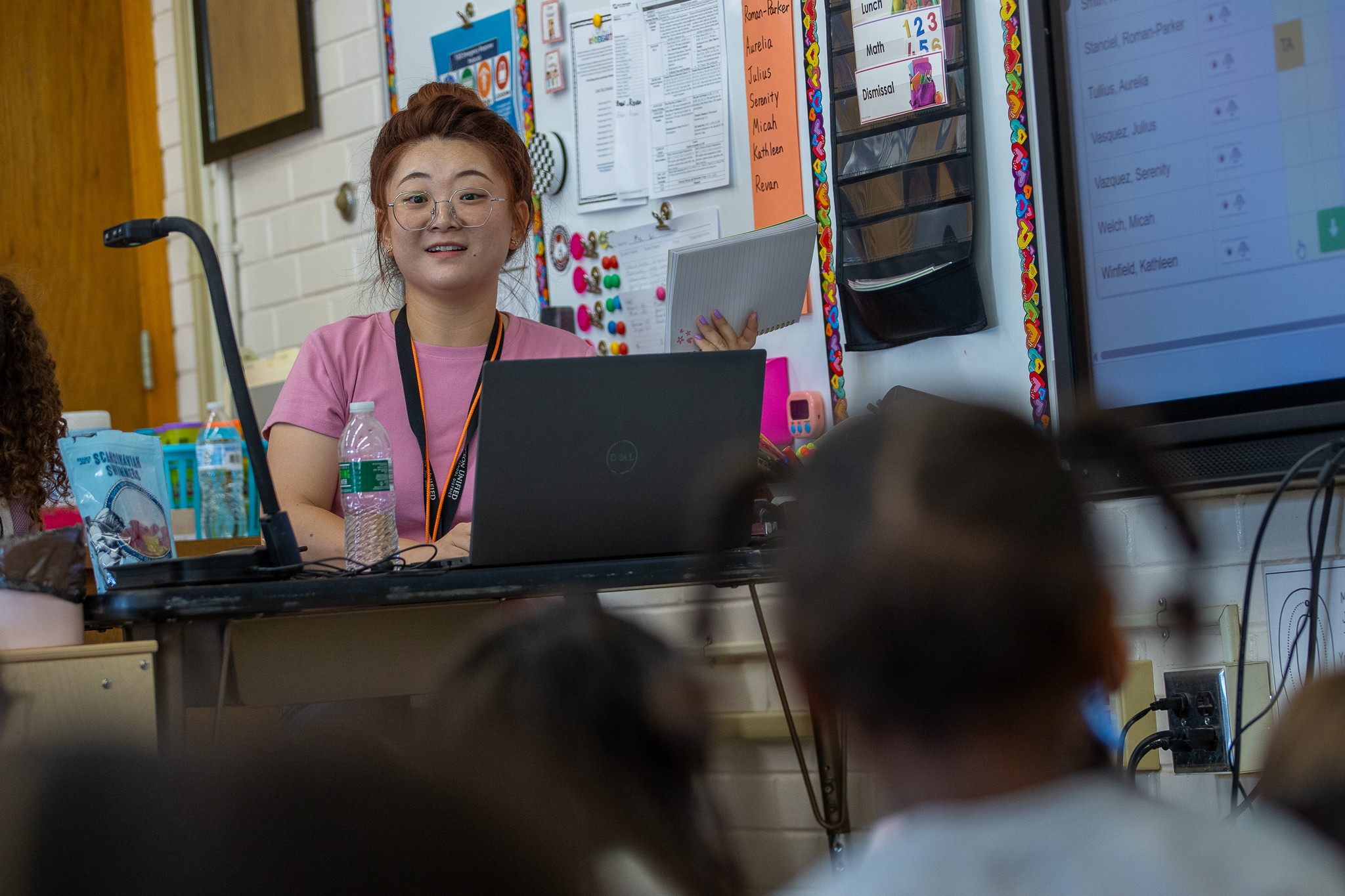 A teacher smiles at her class